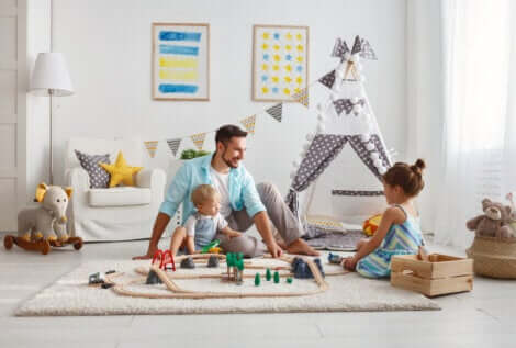 Vater und Kinder spielen ohne Bildschirme